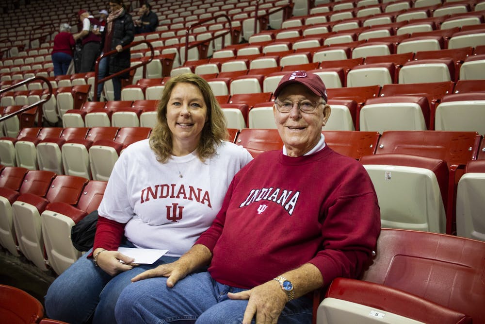 Fred Farris, 76, sits with his daughter Michele Reed on Jan. 11 before the game against Ohio State in Simon Skjodt Assembly Hall. Farris received the basketball tickets from his daughter and her husband for Christmas, and then his tickets were upgraded to be closer to the court. 