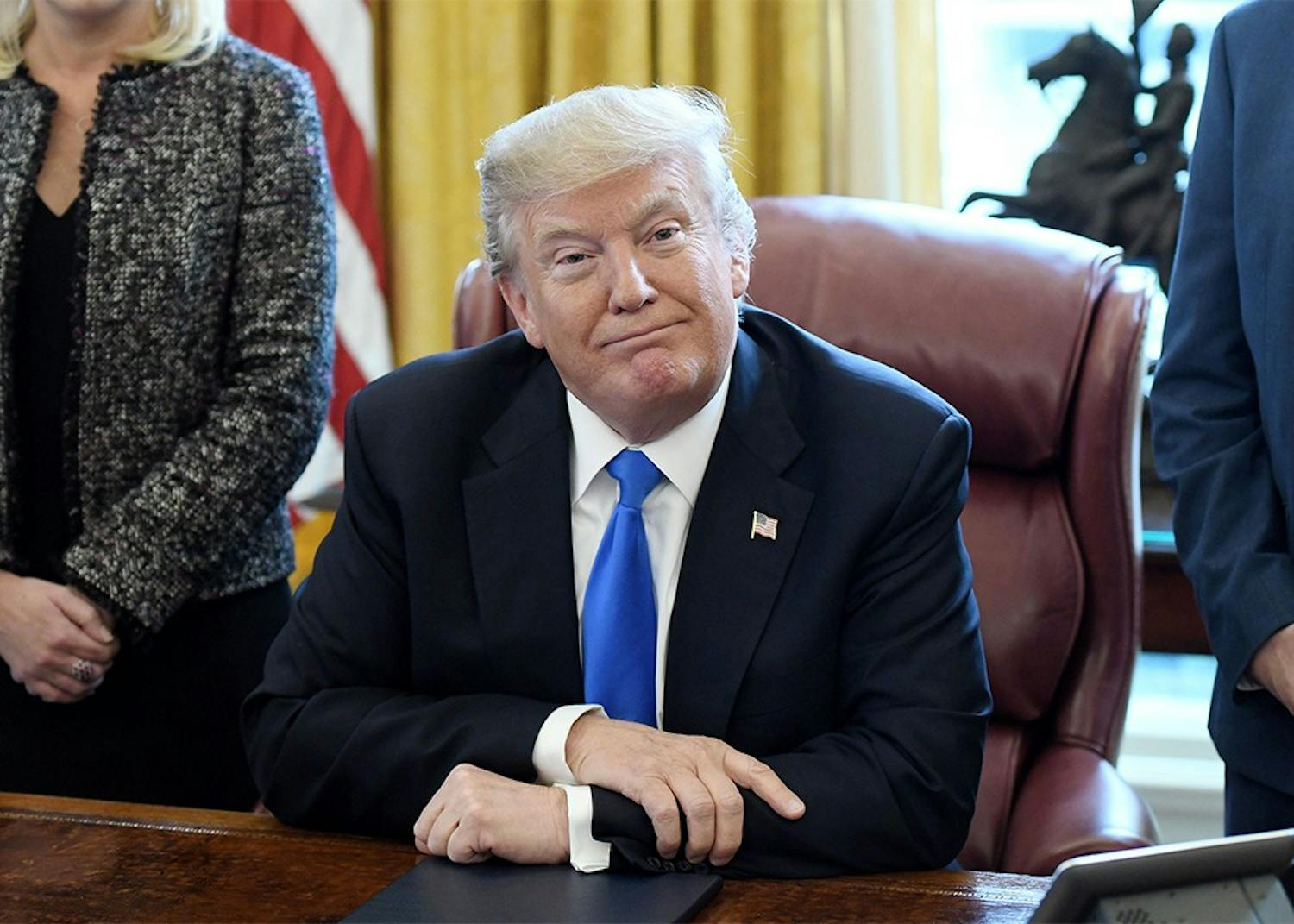 President Trump looks on after signing an executive order on "Supporting our Veterans during their Transition from Uniformed Service to Civilian Life" on Jan. 9. Trump and Vice President Mike Pence will appear at a rally Thursday night in Elkhart, Indiana.&nbsp;