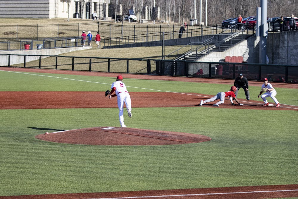 <p>Freshman pitcher Luke Hayden attempts a pick off throw against Miami University (Ohio) on March 1, 2022, at Bart Kaufman Field. Indiana opened its two-game home stand with a 7-0 win over the University of Cincinnati on Tuesday.</p>