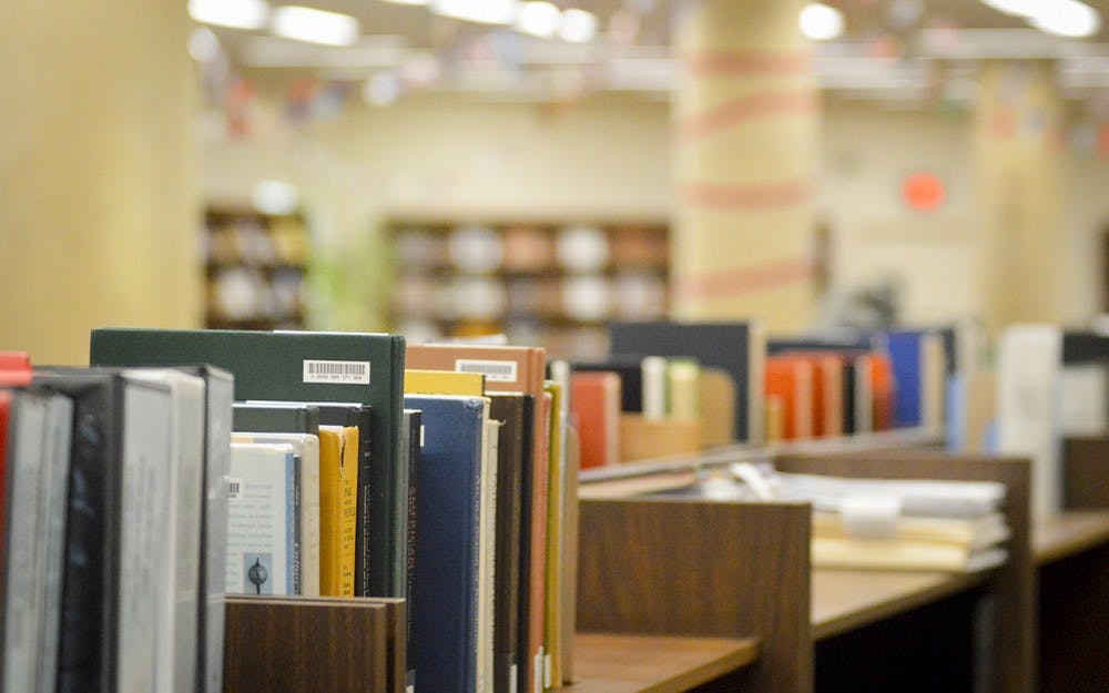 A small shelf of books sit on the first floor of the Fine Arts Library located within the Eskenazi Art Museum as the branch prepares to close its doors. 