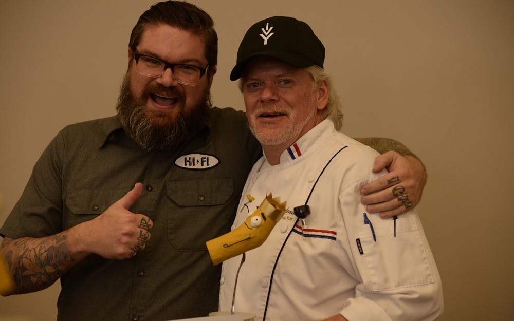 R.J. Wall, co-founder of the Return of the Mac Fest,&nbsp;and&nbsp;Allen Edwards, chef instructor at Ivy Tech Community College Bloomington, pose with the Golden Noodle award. Edwards and the Ivy Tech Culinary Program won the judge's choice for best macaroni and cheese Sunday for their smoky bleu quack and cheese.&nbsp;