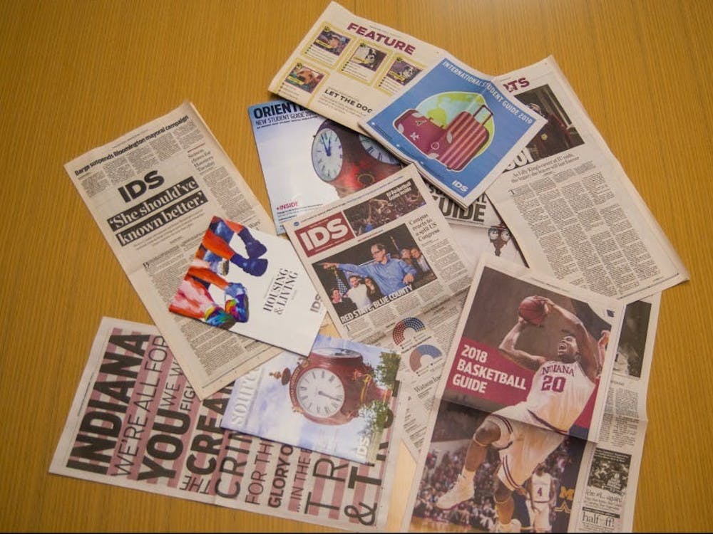 A collection of Indiana Daily Student publications lay on a table. The IDS took home a Hybrid News Gold Crown from the Columbia Scholastic Press Association.