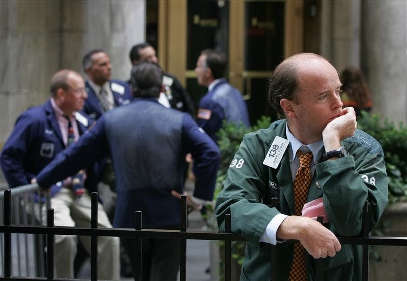 Stock broker Andrew O'Connor takes a break from his floor position at the New York Stock Exchange on Monday in New York. A stunning reshaping of the Wall Street landscape sent stocks tumbling Monday, but the pullback appeared relatively orderly perhaps because investors were unsurprised by the demise of Lehman Brothers Holdings Inc. and relieved by a takeover of Merrill Lynch & Co.