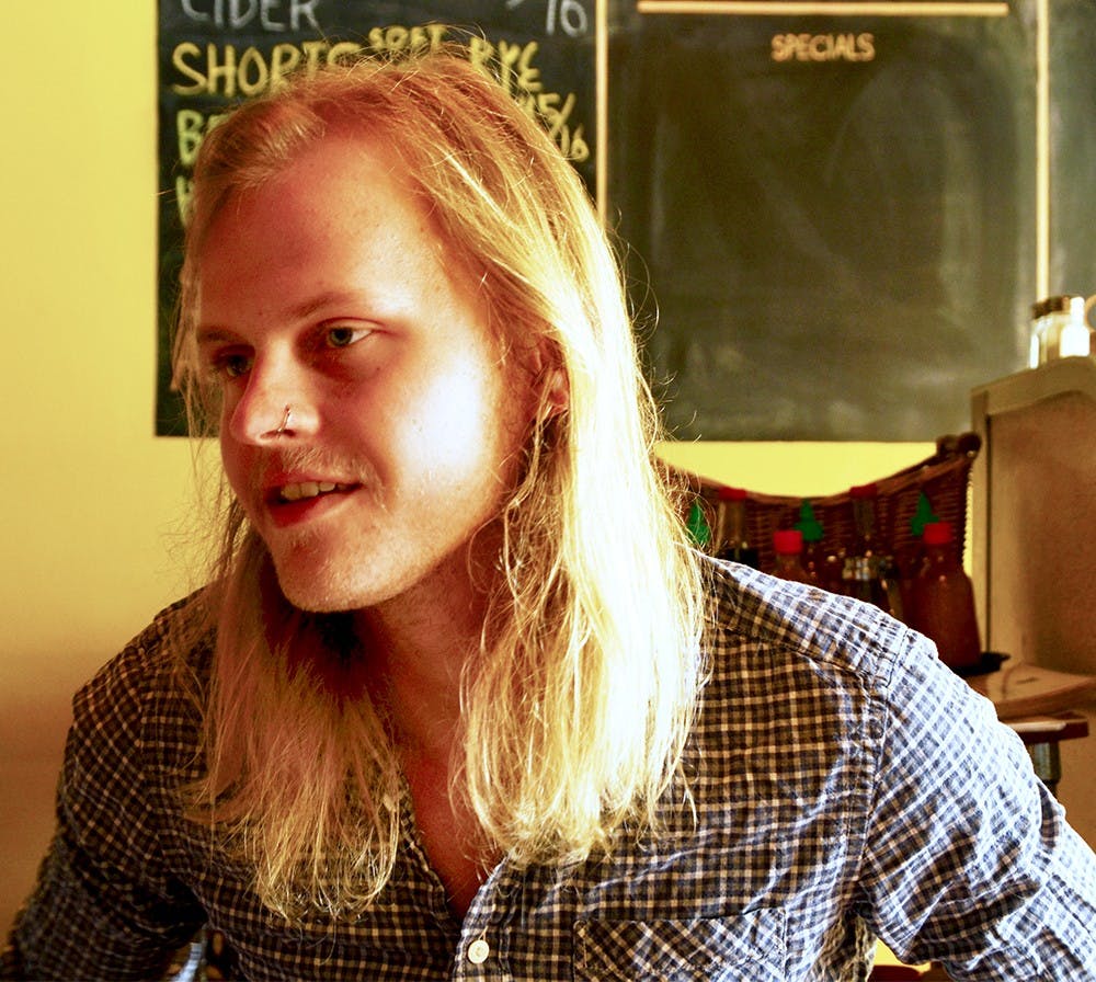 Ben Craig, local song writer, talks during the interview Monday at the Owlery restaurant. Craig said that Bloomington has been a musical friendly place since many young people visit and live. 