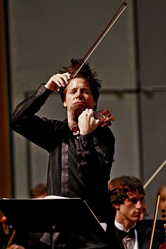 Joshua Bell performs a piece from "The Red Violin" with the IU Philharmonic Orchestra Wednesday evening at the IU Auditorium. This was the first performance of Bell as an IU faculty member.
