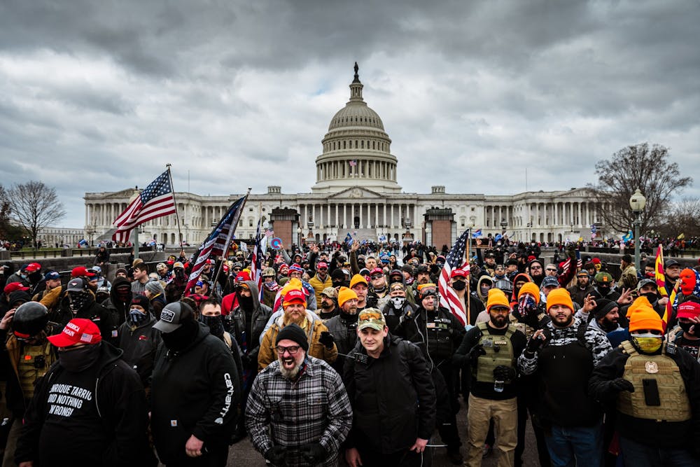 <p>A mob of supporters of former president Donald Trump congregate outside of the U.S. Capitol Building on Jan. 6, 2021, in Washington, D.C. Of the more than 700 people who have been charged in relation to the insurrection, eight were from Indiana, and one was a former IU student. </p>