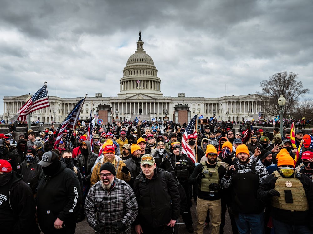 A mob of supporters of former president Donald Trump congregate outside of the U.S. Capitol Building on Jan. 6, 2021, in Washington, D.C. Of the more than 700 people who have been charged in relation to the insurrection, eight were from Indiana, and one was a former IU student. 