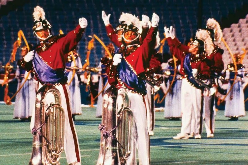 Two Star of Indiana contra bass players pose during the corps's 1991 "Roman Images, the Music of Respighi." The show earned Star its first and only DCI Championship and became a statement to the talents of the legendary drill designer George Zingali, who died following the 1991 season.