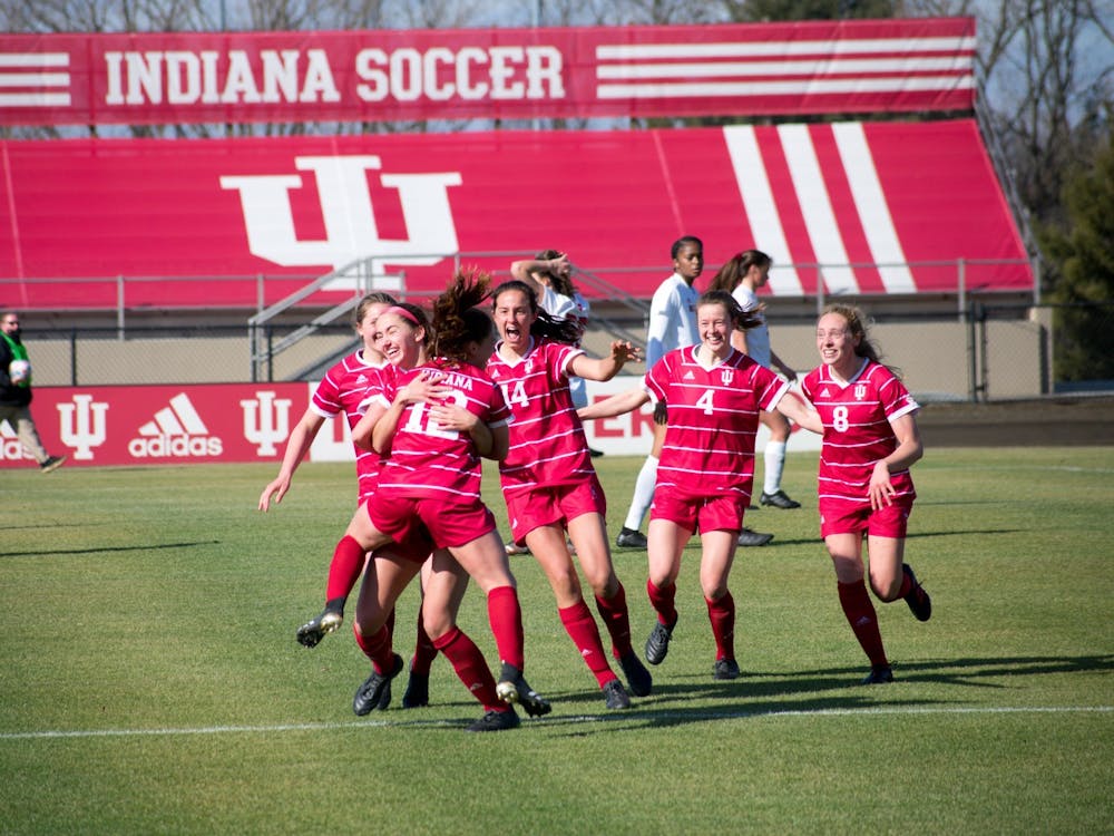 Players on the Indiana women&#x27;s soccer team celebrate Feb. 25, 2021. The team will play Michigan State University at 7 p.m. Oct. 13, 2022, in East Lansing, Michigan.