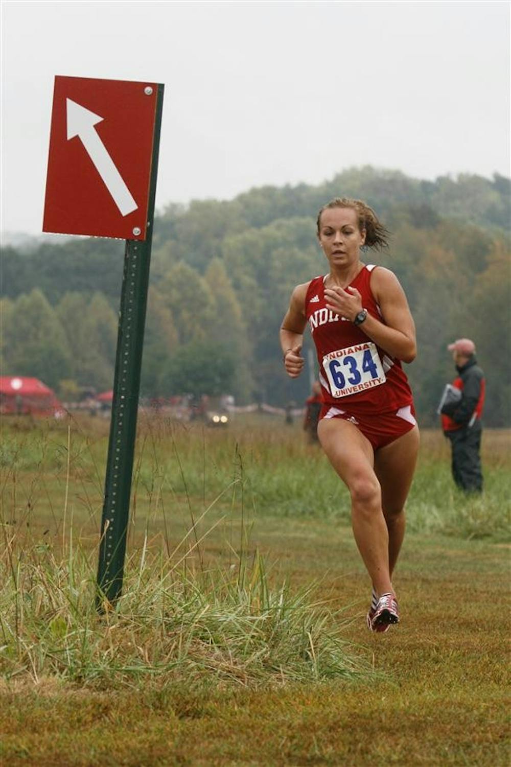 Sophomore Sarah Pease takes a turn Saturday at the Indiana Open at the IU cross country course. Pease finished first in the 5k race with a time of 18:12.86.