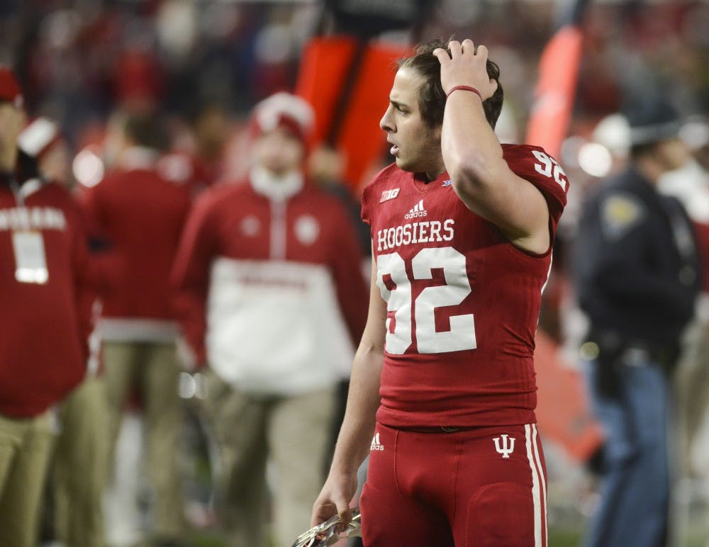 Kicker Griffin Oakes reacts after missing a 38-yard field goal in overtime after the Pinstripe Bowl against Duke on Dec. 26 at Yankee Stadium. The Hoosiers lost, 44-41.