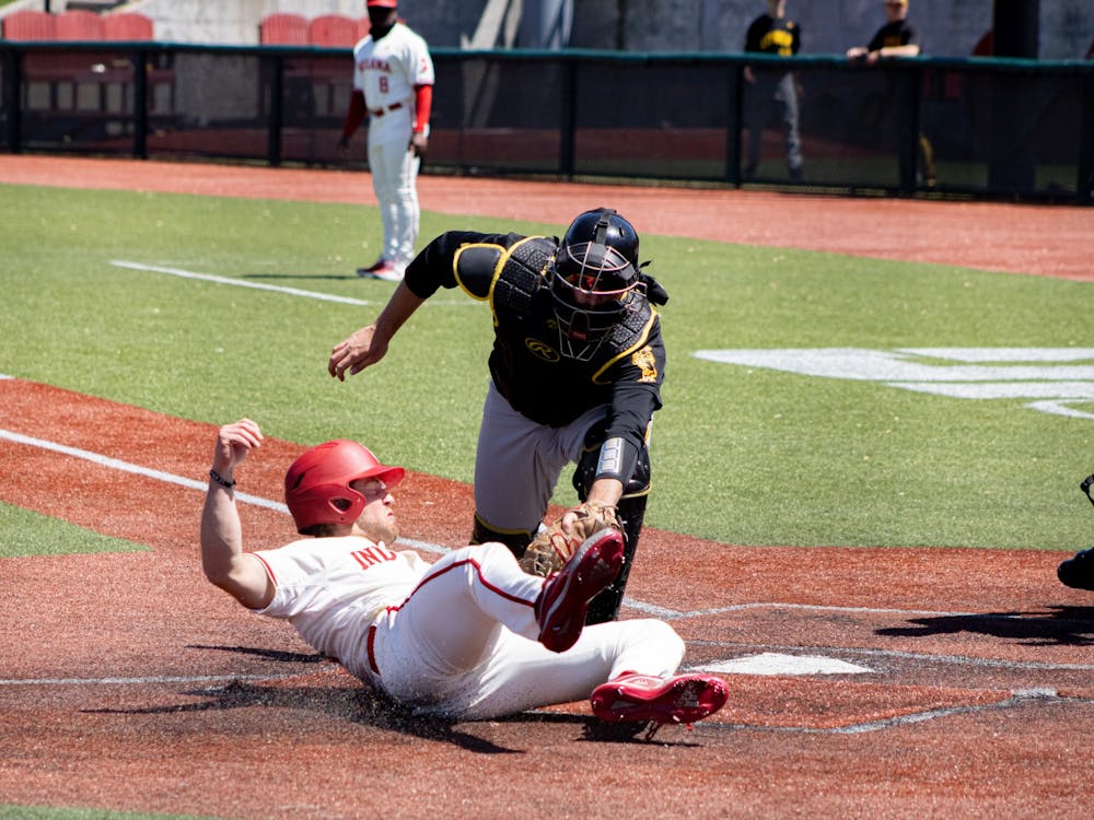 Sophomore outfielder Tyler Van Pelt slides into home plate Saturday at Bart Kaufman Field. The Hoosiers went 2-1 this weekend against Iowa at home. 