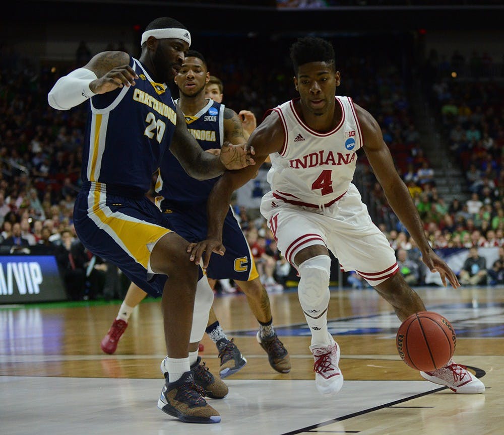Sophomore guard Robert Johnson drives to the basket during the NCAA game against Chattanooga on Thursday at the Wells Fargo Arena in Des Moines, Iowa.