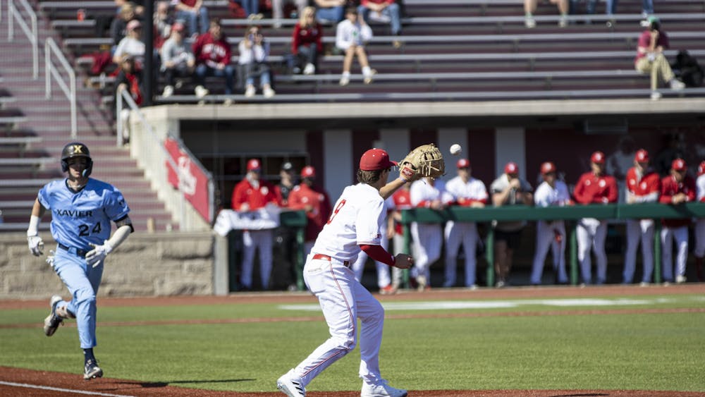 Freshman first baseman Brock Tibbitts catches a throw to first during the first game against Xavier on March 20, 2022, at Bart Kaufman Field. Indiana defeated Xavier 13-3 in the first of two games Sunday.
