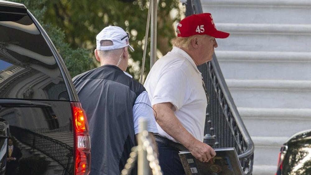 U.S. President Donald Trump returns to the White House after spending the day golfing Sept. 28 in Washington, D.C. Trump mounted a defense to Democrats&#x27; impeachment investigation Saturday by saying the opposition party is trying to oust him.