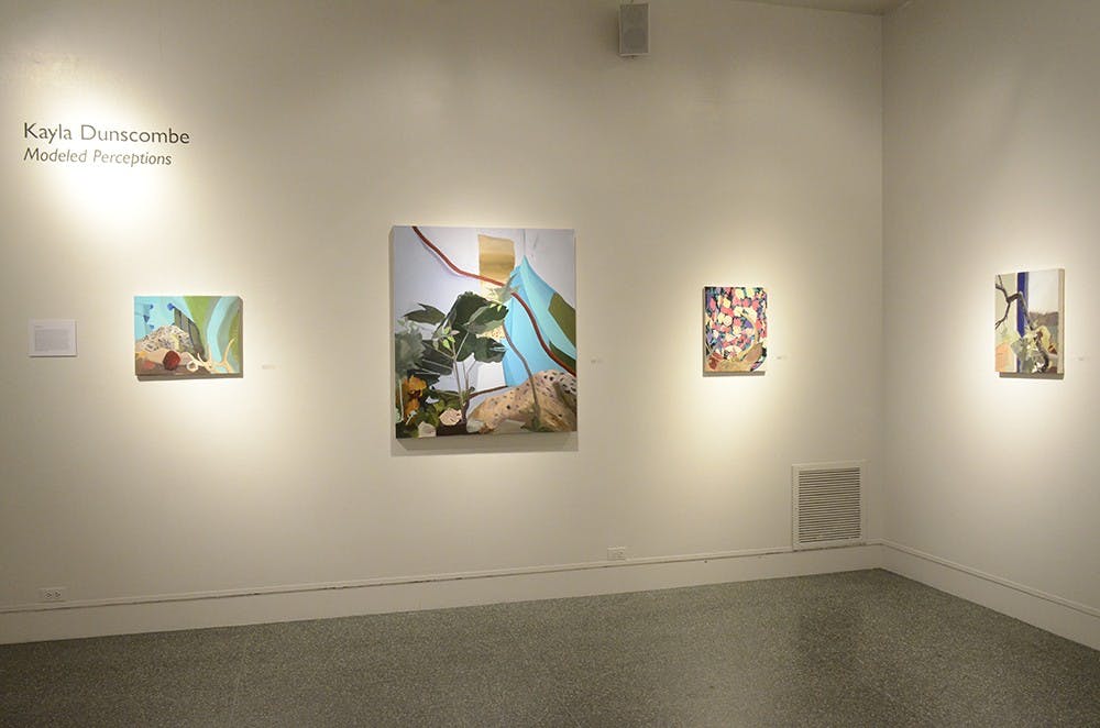 BFA Kayla Dunscombe's Modeled Perceptions themed paintings are displayed in the Grunwald Gallery of Art. 