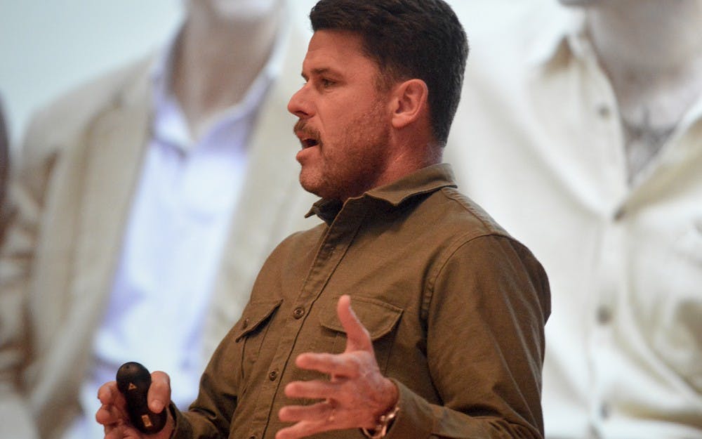 Movember Foundation founder Adam Garone combats prostate and testicular cancer while discussing suicide prevention Friday evening in Alumni Hall.