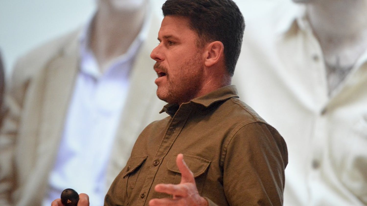 Movember Foundation founder Adam Garone combats prostate and testicular cancer while discussing suicide prevention Friday evening in Alumni Hall.