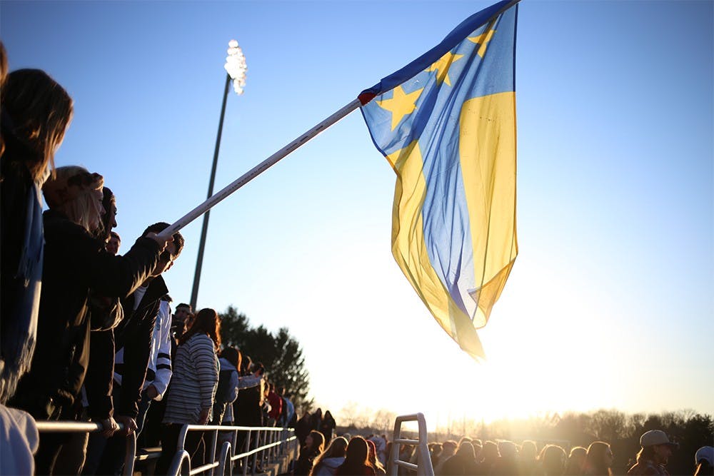 Fans hold the Alpha Tau Omega flag in the stands of Bill Armstrong Stadium during Little 500 Qualifications on March 28, 2015. . ATO will not compete in the 2016 Little 500 due to the fraternity having their charter revoked last semester.