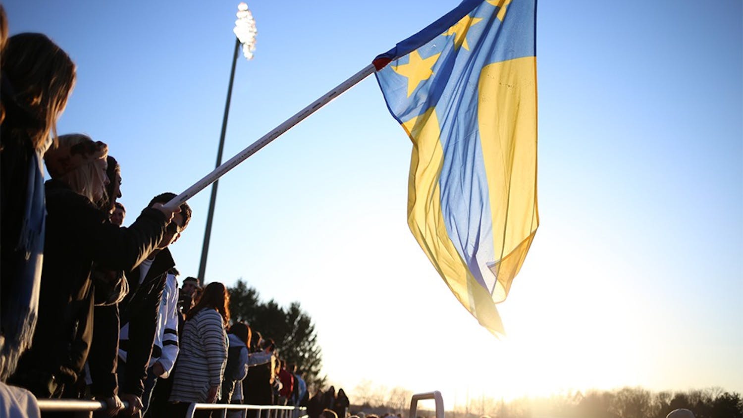 Fans hold the Alpha Tau Omega flag in the stands of Bill Armstrong Stadium during Little 500 Qualifications on March 28, 2015. . ATO will not compete in the 2016 Little 500 due to the fraternity having their charter revoked last semester.