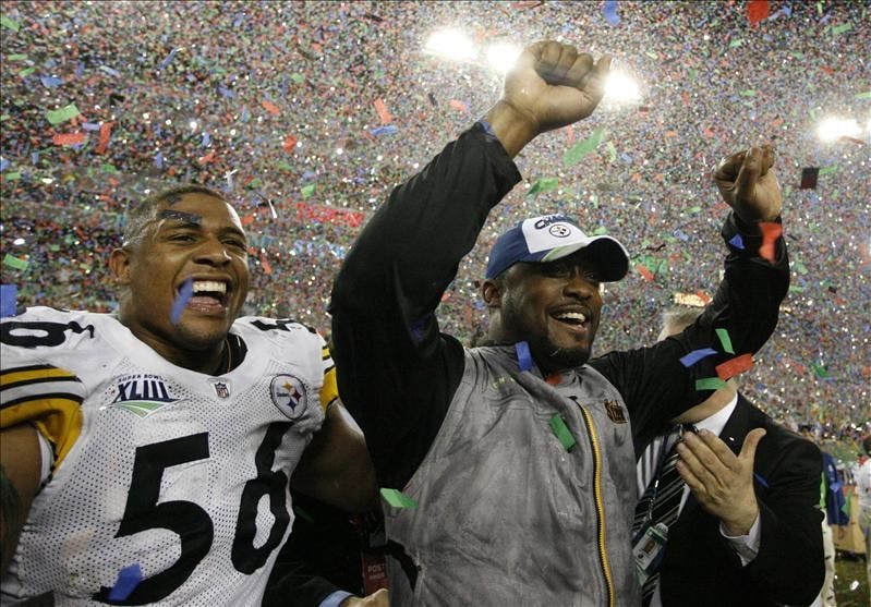 Pittsburgh Steelers head coach Mike Tomlin and linebacker LaMarr Woodley celebrate the team's 27-23 win over the Arizona Cardinals in the NFL Super Bowl XLIII football game, Sunday in Tampa, Fla.
