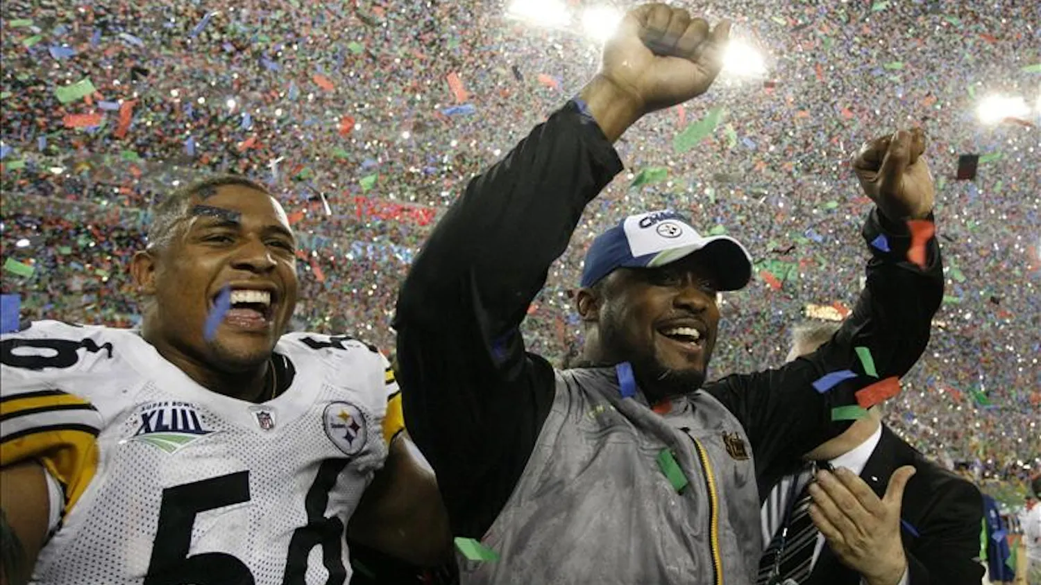 Pittsburgh Steelers head coach Mike Tomlin and linebacker LaMarr Woodley celebrate the team's 27-23 win over the Arizona Cardinals in the NFL Super Bowl XLIII football game, Sunday in Tampa, Fla.