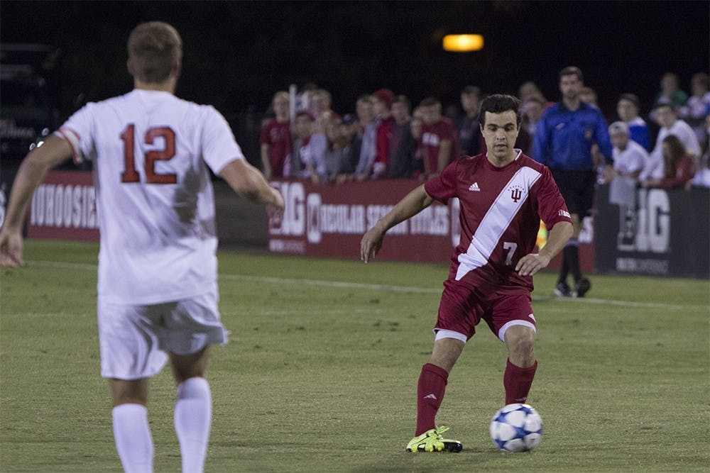 Senior midfielder Matt Foldesy keeps the ball from a defender during a game against Ohio State on Saturday night at Jerry Yeagley field. The Hoosiers lost 1-0 in overtime.