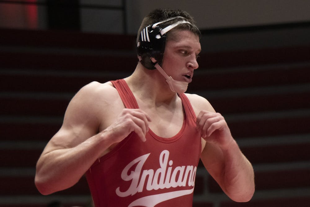 <p>Redshirt junior Jake Kleimola walks away from the benches Feb. 9 during the wrestling match against Nebraska at Wilkinson Hall. IU will compete against Southern Illinois University Edwardsville on Sunday in Bloomington.</p>