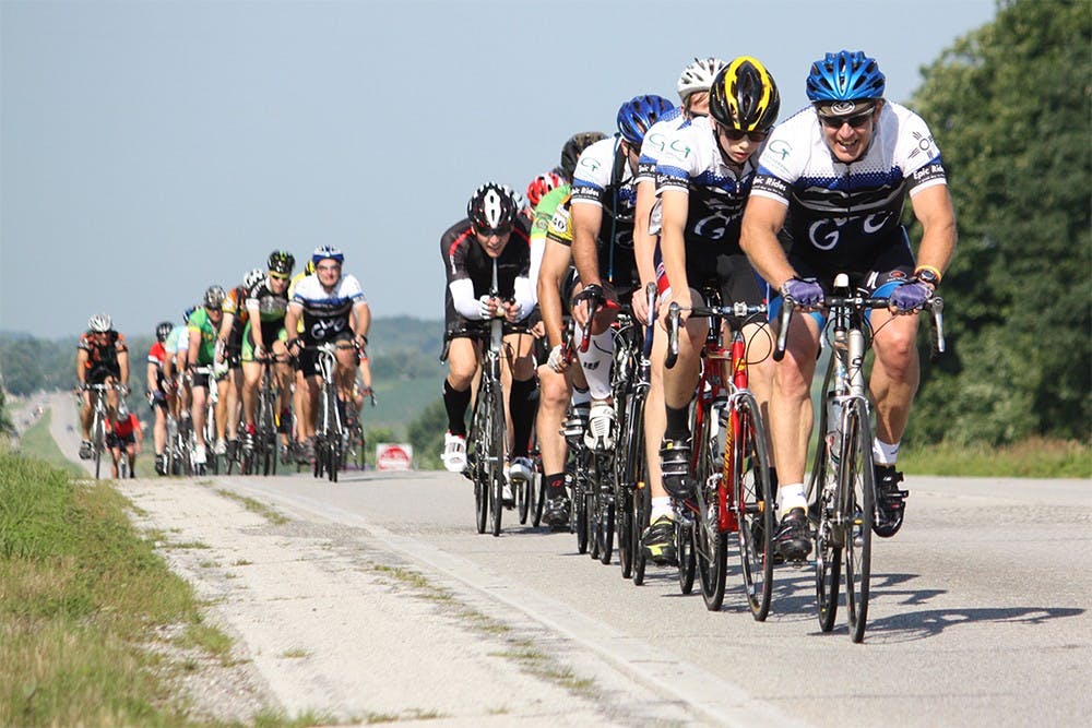 Cyclist ride in a line during the Ride Across Indiana event put on by the Bloomington Bicycle Club.  The club rode on U.S. Route 40 to make their way across the state.