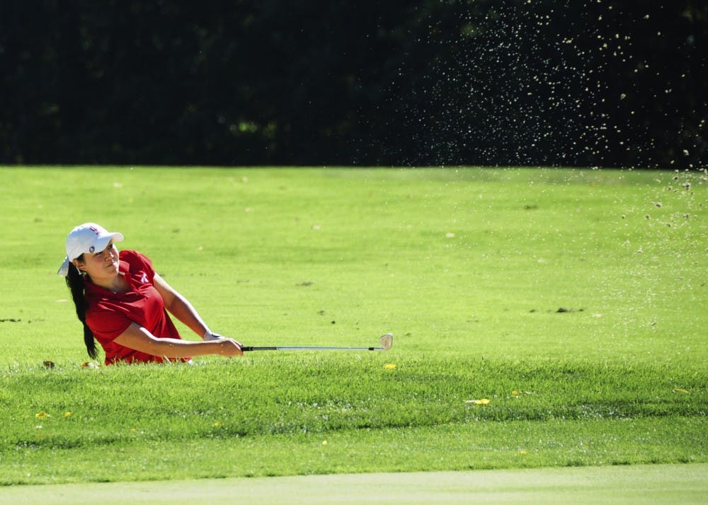 <p>Then-sophomore Elizabeth Tong hits the ball out of a bunker on Sept. 8, 2012, at the IU Women's Golf Fall Kickoff at the IU Golf Course. The IU golf course is currently being remodeled.</p>