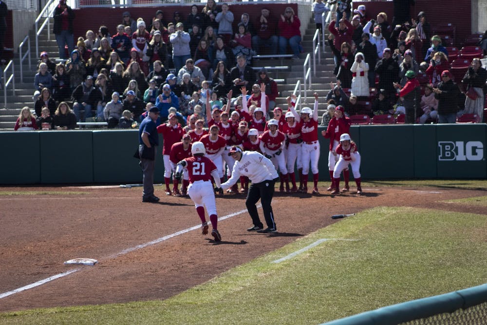 <p>Then-freshman Juvia Davis is greeted March 17, 2019, by her teammates at home plate after hitting a grand slam for the Hoosiers. IU softball starts its 2021 season this weekend in Leesburg, Florida. </p>