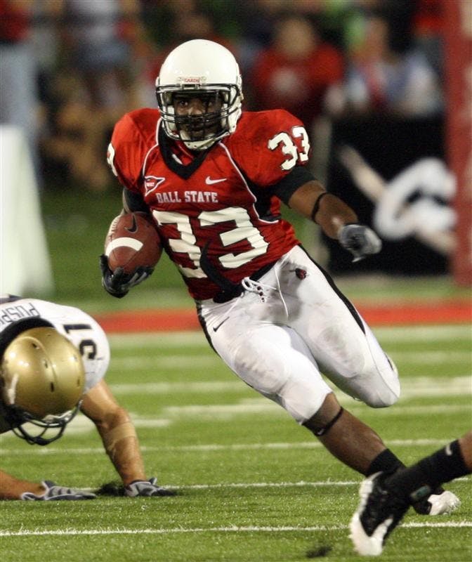 Ball State's MiQuale Lewis runs with the ball in the second half of the NCAA football game against Navy on Friday in Muncie, Ind. Ball State won 35-23. 