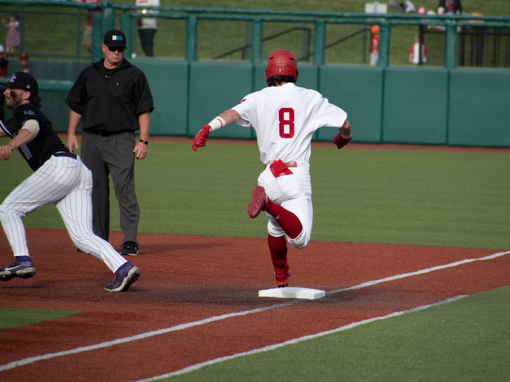 Freshman infielder Tyler Cerny runs to first base May 16, 2023 at Bart Kaufman Field against University of Evansville in Bloomington.