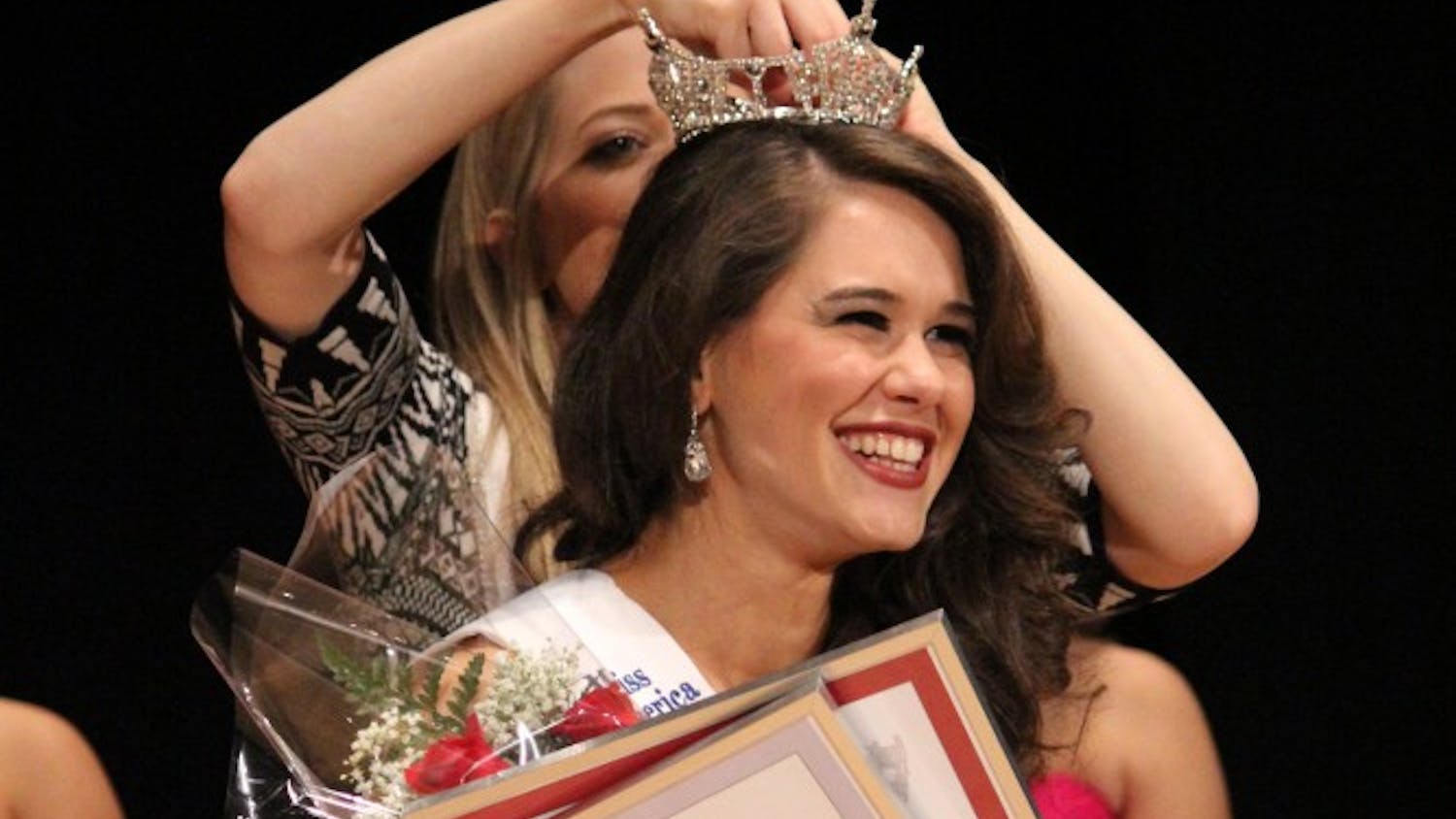 Lauren Mnayarji, a psychology and journalism major, is crowned Miss Indiana University 2015 by Miss Indiana 2014 Audra Casterline.
