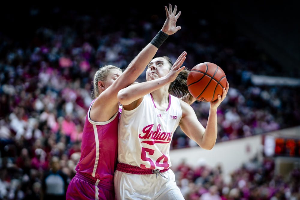 <p>Senior forward MacKenzie Holmes attempts a shot Feb. 9, 2023, at Simon Skjodt Assembly Hall in Bloomington. The Hoosiers beat Iowa 87-78.</p>