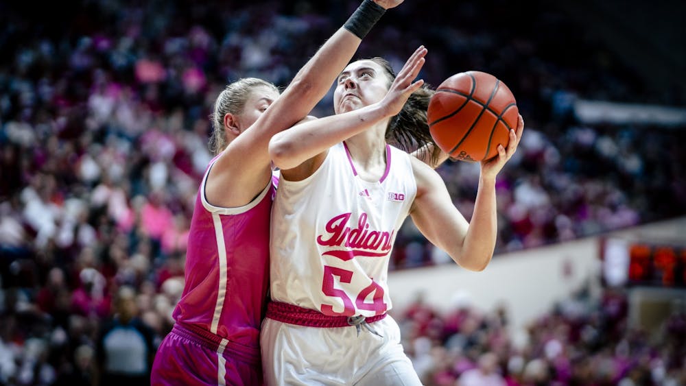 Senior forward MacKenzie Holmes attempts a shot Feb. 9, 2023, at Simon Skjodt Assembly Hall in Bloomington. The Hoosiers beat Iowa 87-78.