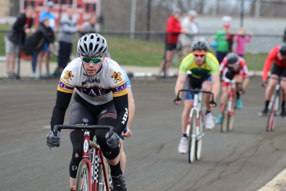 <p>Sigma Alpha Epsilon rider Sean Marks leads heat 14 of the Miss N Out event in his white, gold and purple kit. This event took place Saturday, March 31, at Bill Armstrong Stadium.</p>