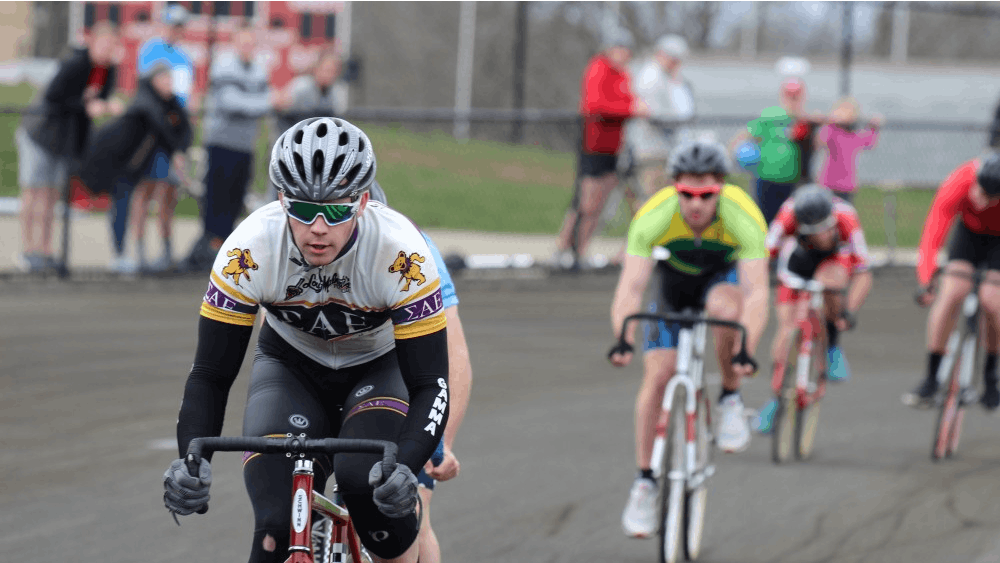 Sigma Alpha Epsilon rider Sean Marks leads heat 14 of the Miss N Out event in his white, gold and purple kit. This event took place Saturday, March 31, at Bill Armstrong Stadium.
