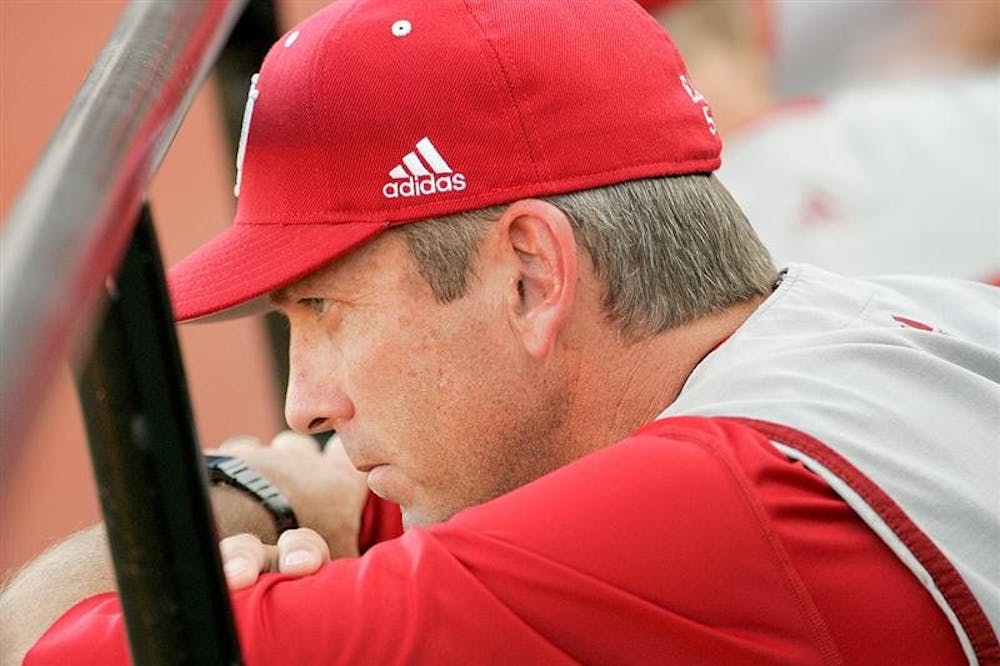 IU head baseball coach Tracy Smith watches the Hoosiers 8-2 loss to Louisville unfold Friday evening at Patterson Stadium. Hoosier pitchers gave up only seven hits but three errors leading to four unearned runs for the Cardinals.