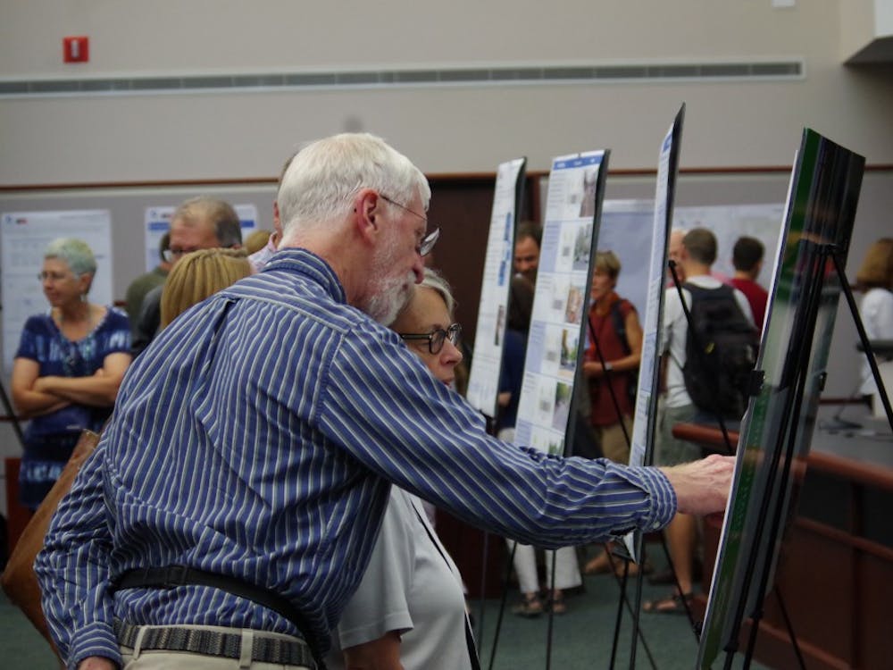 Bloomington residents review the draft of the city's new transportation plan that was presented for public comment Thursday night at City Hall.