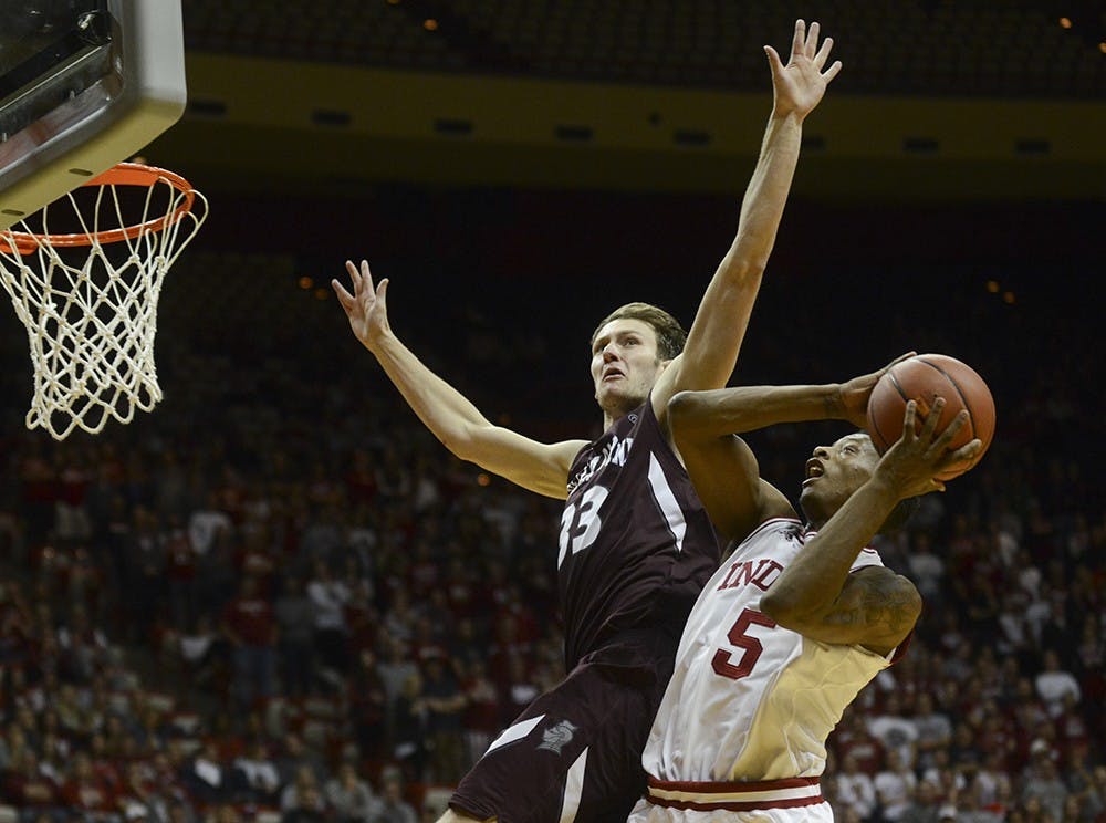 Junior forward Troy Williams shoots a layup as Bellarmine's Josh Derksen guards on Monday evening at Assembly Hall. The Hoosiers won, 73-62.
