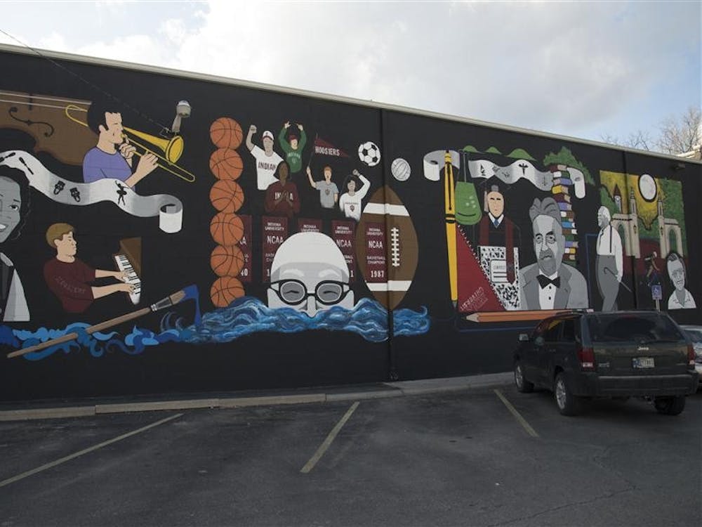 The mural on the side of the T.I.S. College Bookstore is divided into four sections honoring IU's legends and strengths: music and art, sports, education and campus.
