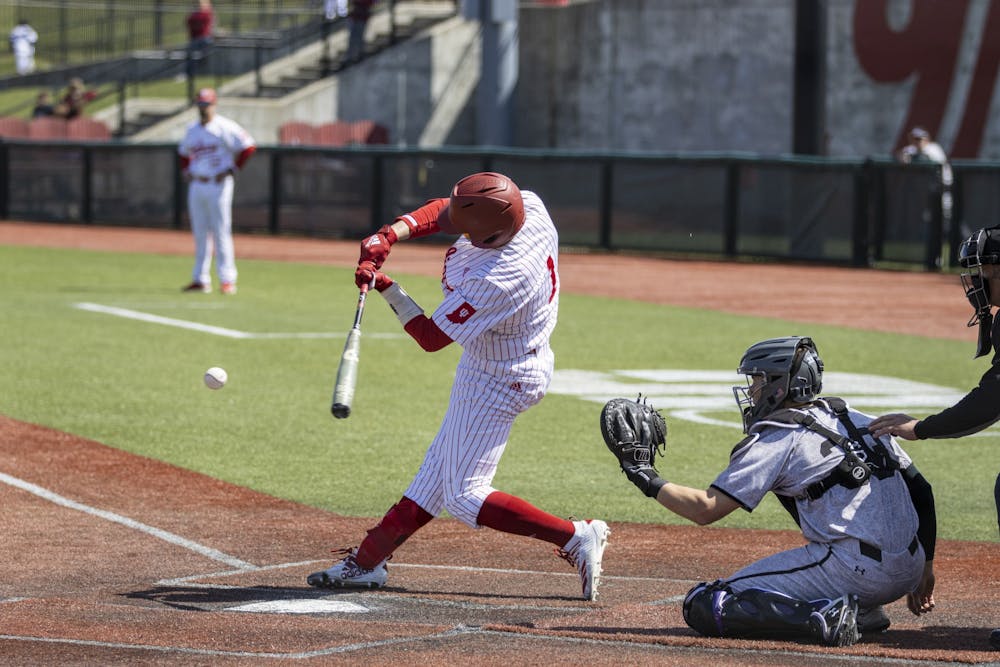 <p>Senior infielder Phillip Glasser swings at a pitch against Northwestern on April 2, 2022, at Bart Kaufman Field. Indiana dropped to 11-15 this season after winning one of three games against Northwestern this weekend.</p>