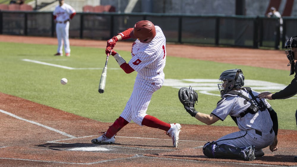 Senior infielder Phillip Glasser swings at a pitch against Northwestern on April 2, 2022, at Bart Kaufman Field. Indiana dropped to 11-15 this season after winning one of three games against Northwestern this weekend.