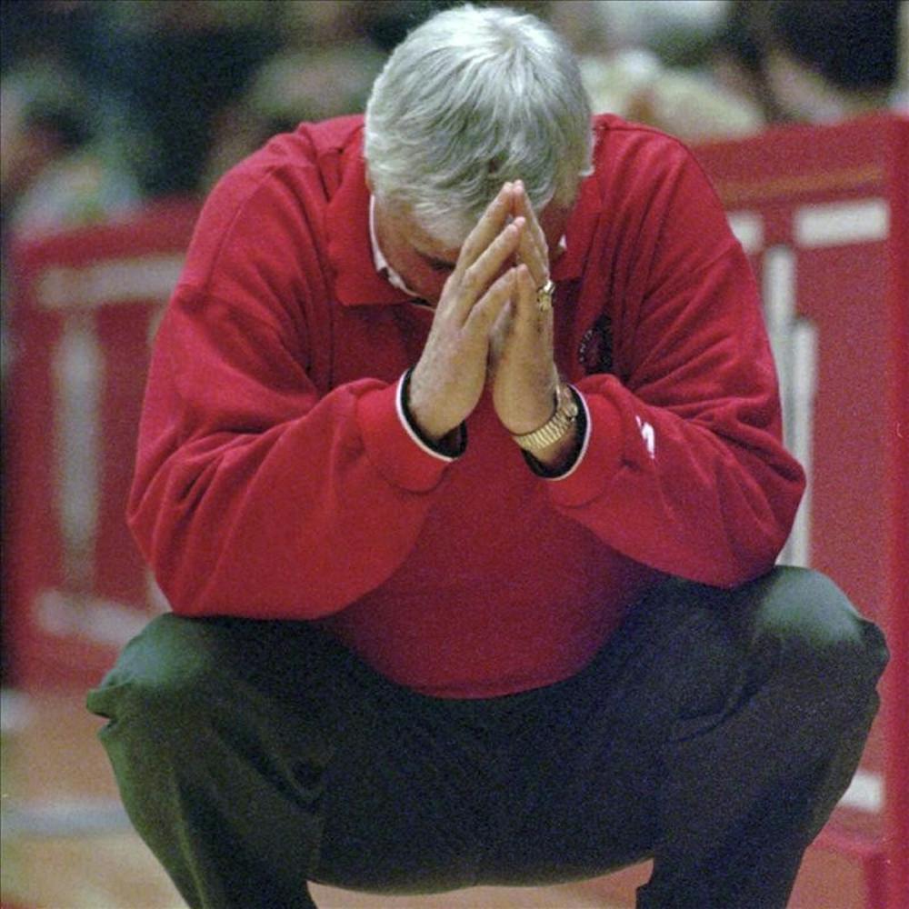 Indiana coach Bobby Knight crouches down in frustration as his team relinquishes their lead in the final minutes against Illinois, in this February 2, 1997 photo, in Bloomington, Ind. 