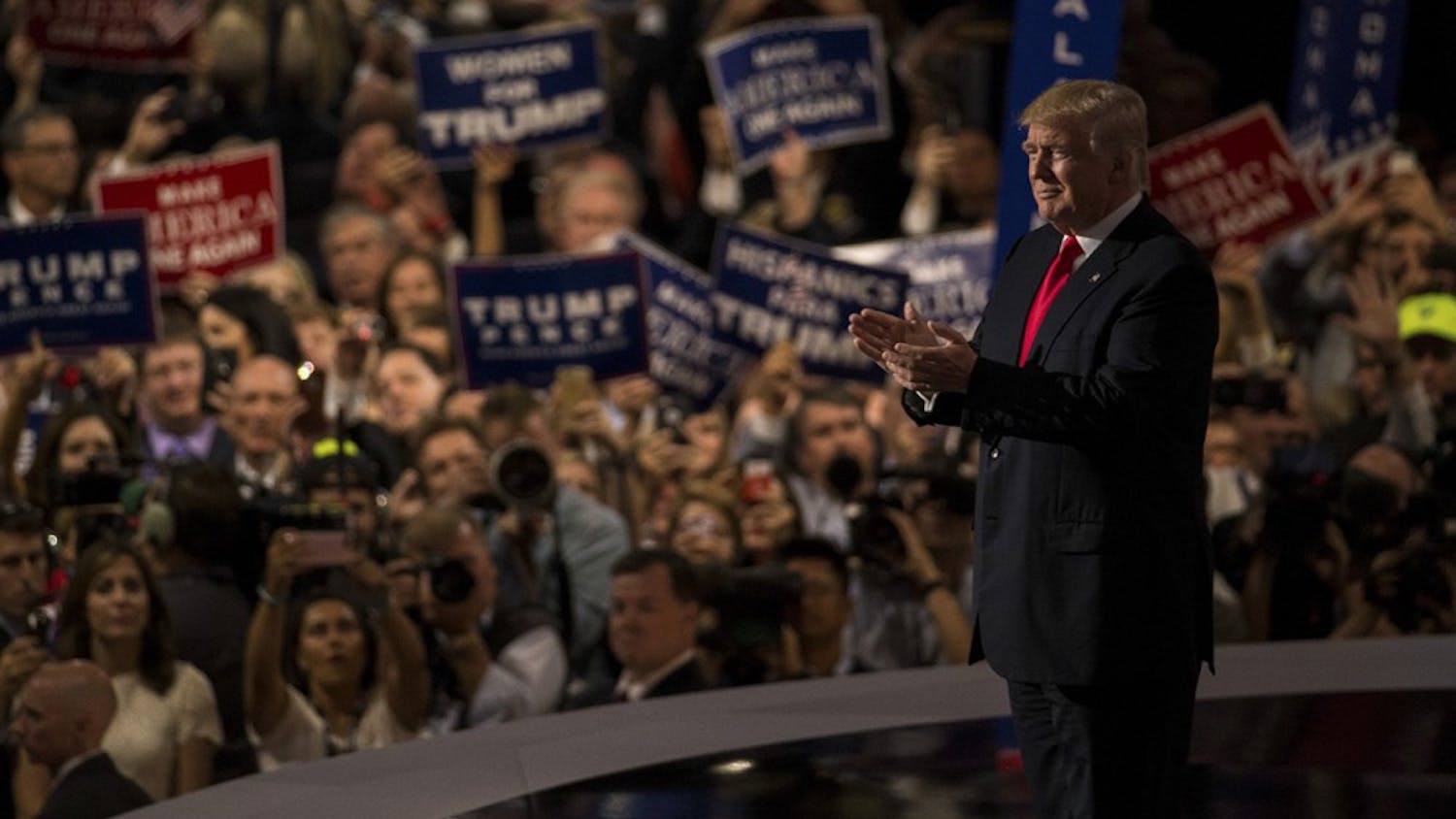 Republican presidential nominee Donald Trump claps with the audience shortly after walking on stage Thursday night at the Quicken Loans Arena in Cleveland, Ohio to accept the nomination of the Republican Party for president of the United States.