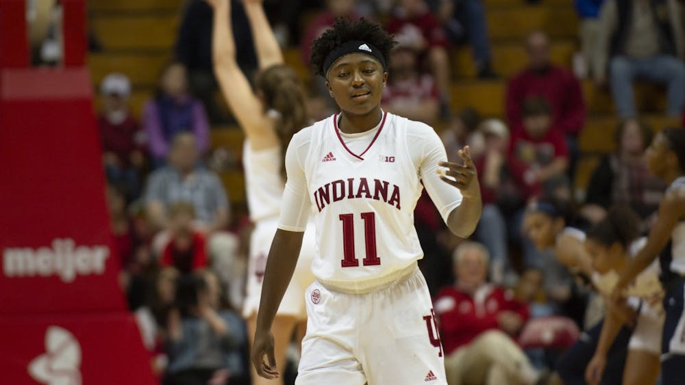 Redshirt freshman Chanel Wilson gets ready to play defense as a teammate shoots a free throw behind her Nov. 17 at Simon Skjodt Assembly Hall. IU women&#x27;s basketball was ranked No. 18 in the Associated Press Top 25 rankings Monday, the highest ranking in program history.