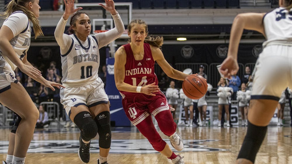 Then-graduate guard Ali Patberg dribbles through the Butler defense during the game against Butler University on Nov. 10, 2021, at Hinkle Fieldhouse. Patberg will return to Indiana next season as an assistant coach.