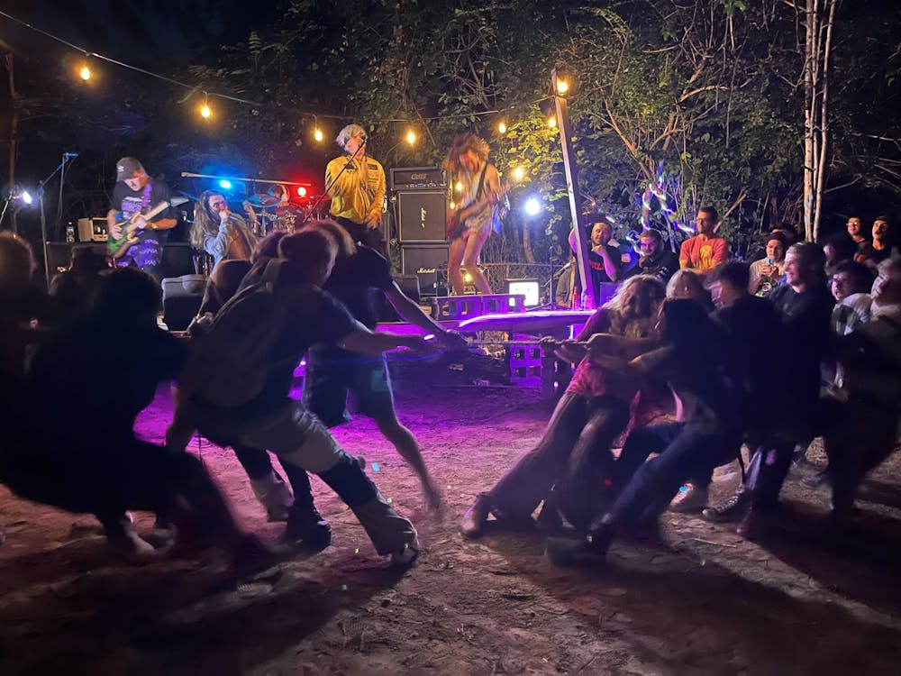 <p>The pit splits in two for a spirited game of tug of war whilst metal core band Spawn plays in the background Sept. 8, 2023. Four Indiana-based bands came together for music, madness and tug of war. <br/></p><p></p>