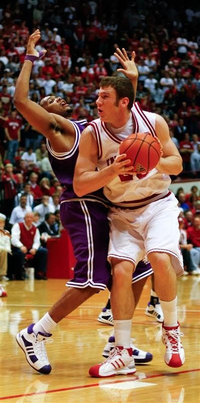 Freshman forward Tom Pritchard battles a Northwestern State defender during the Hoosiers 83-65 win over Northwestern State on Saturday at Assembly Hall.